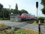 218 404 und 426 bespannen am 24.7.13 einen Eurocity auf der Fahrt nach M�nchen Hauptbahnhof, hier an der klassischen Fotostelle am Schrankenposten Nr.48 in Lindau.